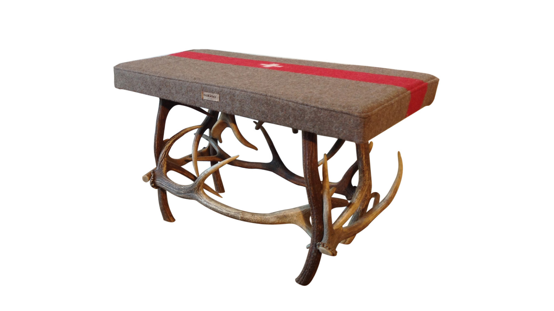 Eskimo bench with Swiss military blanket on antlers